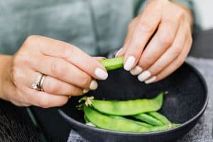 Person Holding Snap Pea